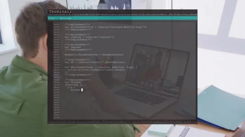 Software dev sitting at desk on remote call, terminal overlay appearing as code Stock Footage 333221560