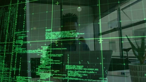 Software dev typing on laptop in office, initiating green code grid sliding over Stock Footage 331227579