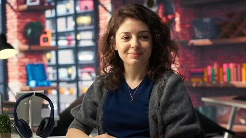 Software developer at agency office coding on her computer, Stockfoto's