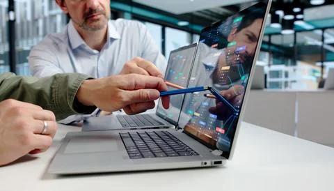 Software Developer And Designer Discuss Visual Workflow Platform On Laptop Us Fotos Stock