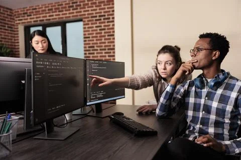 Software developer asking coder for help with html code 写真素材