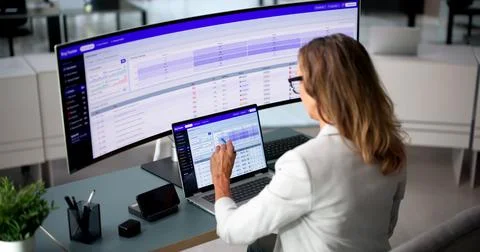 Software Developer Attentively Tracking Bug Reports On Ultrawide Curved Monit Fotos Stock