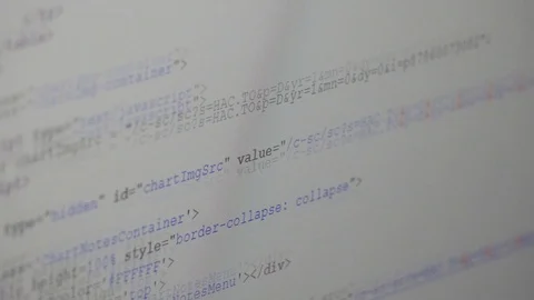 A software developer browsing code on the computer monitor Stock Footage 89997774