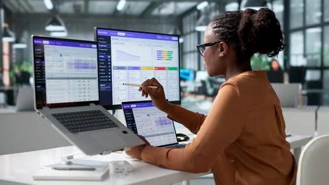 Software Developer Carefully Tracking Bug Reports On Laptop During Sprint Pla Stock Photos