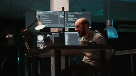 Software developer celebrating coding achievement and typing programming code Stock Footage 224581820