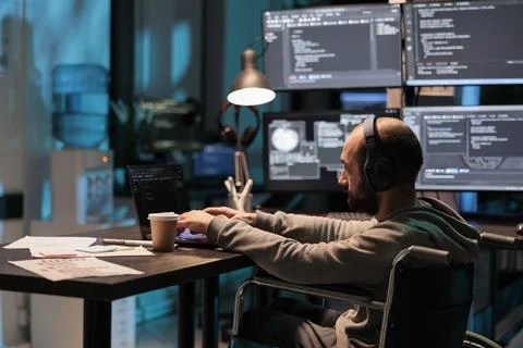 Software developer with chronic disability writing code 스톡 사진