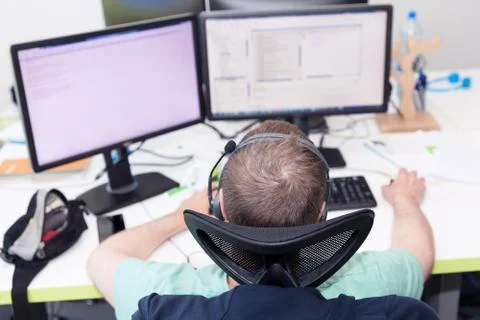 Software developer, coder or programmer working on computer Photos