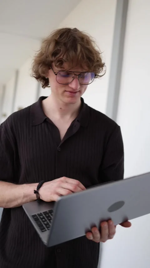 Software developer codes confidently on laptop with full focus Stock Footage 337849808
