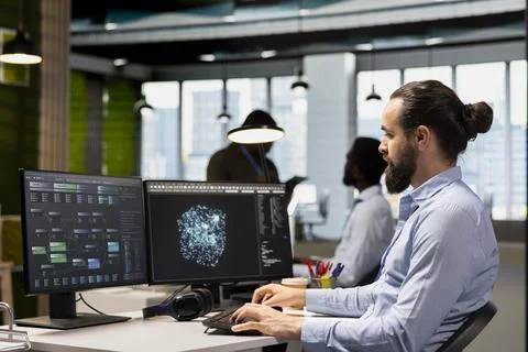 Software developer coding with AI language model assistance Foto stock