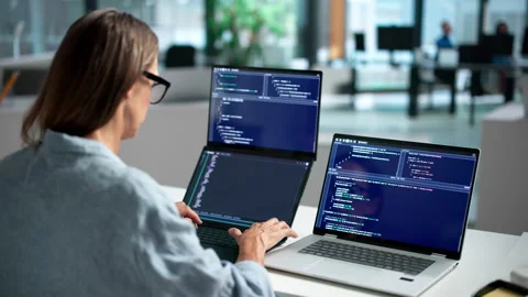 Software Developer Coding On Dual Touchscreen Laptops Video stock 346325643
