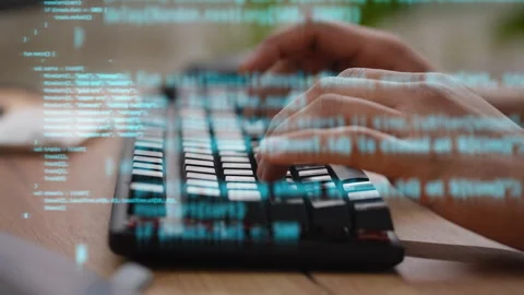 Software developer coding on keyboard with cyber hologram Stock Footage 250989958