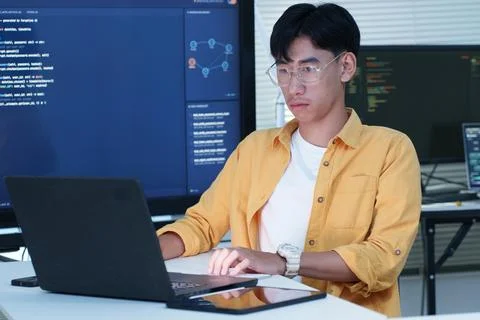 Software Developer Coding on Laptop with Artificial Intelligence Screens Fotos Stock