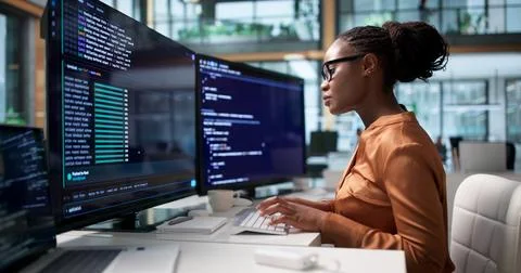 Software Developer Coding Secure Cloud-based Web Applications Remotely Today. Stock Photos