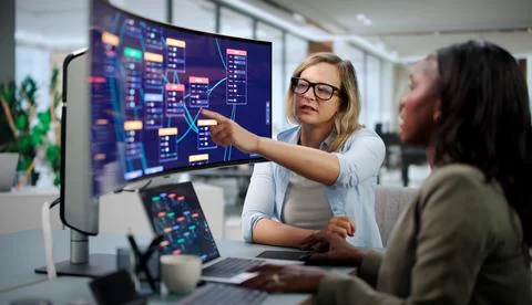 Software Developer Creates Flow-based App Using Drag And Drop Platform. Stock Photos