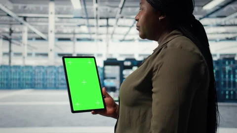 Software developer in data center using green screen tablet Stock Footage 317201851