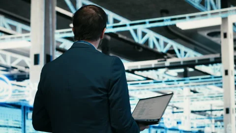 Software developer in data center using laptop to code Stock Footage 329714182