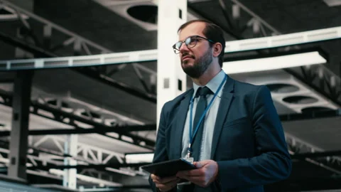 Software developer in data center using tablet and AR tech Stock Footage 329945148