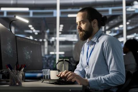 Software developer in data center using AI powered tech to run simulations 写真素材