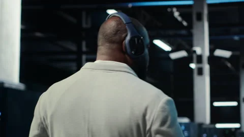 Software developer in data center workspace coding on tablet Stock Footage 311833696