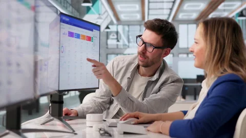 Software Developer Discussing CRM Features During Meeting Stock Footage 332907798