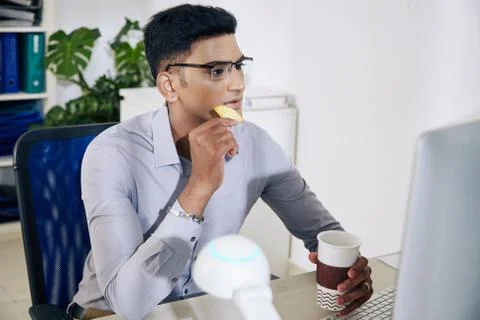 Software developer drinking coffee Stock Photos