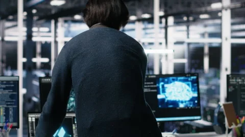 Software developer entering server room office, using AI Stock Footage 313566085