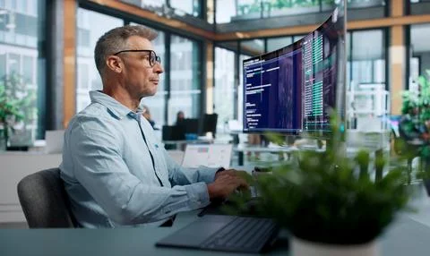 Software Developer Focused On Coding And Pointing At Cloud-based Tools. Stock Photos