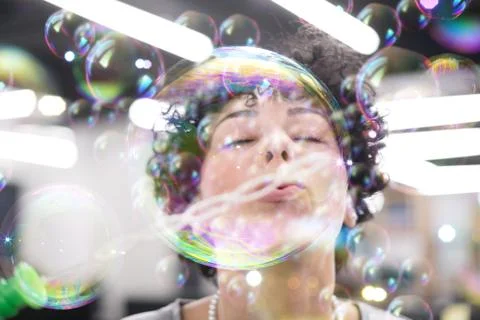 Software developer having fun while making soap bubble 스톡 사진