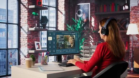 Software developer at home office coding on desktop using AI powered script 스톡 사진