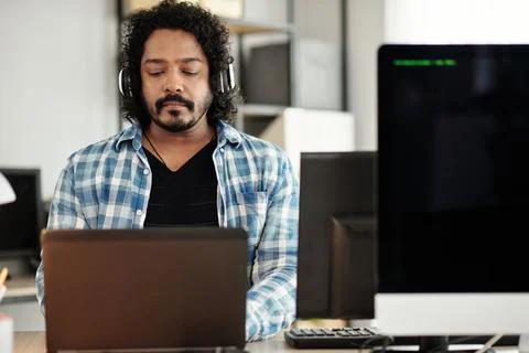 Software Developer Listening to Music Stock Photos
