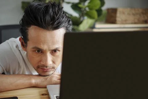 Software developer looking at programming code Stock Photos