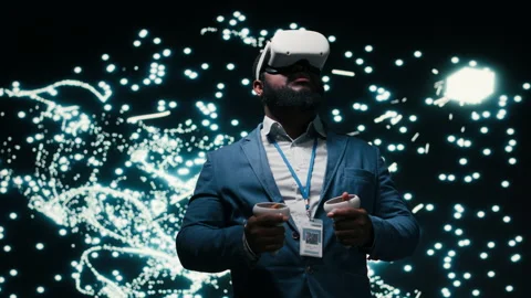Software developer monitoring AI cognitive systems using VR headset gear Stock Footage 330031250