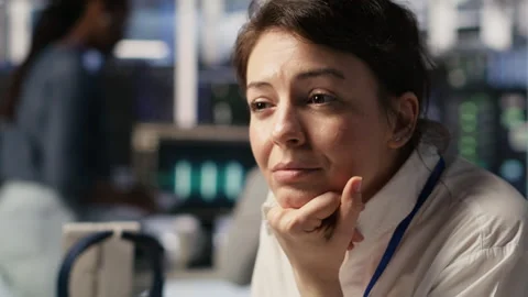 Software developer monitoring server clusters performing AI training, close up Stock Footage 309346928