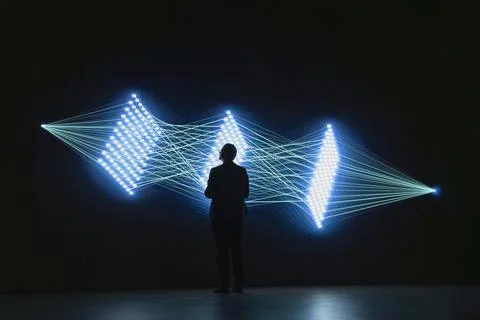 Software developer monitors AI model connections using visual interface 스톡 사진