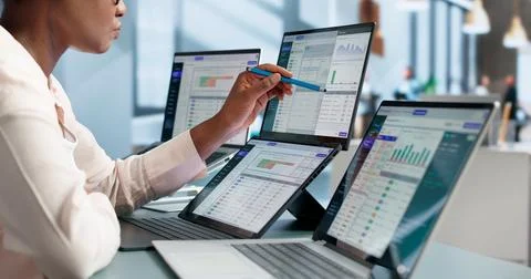 Software Developer Monitors API Gateway Logs On Dual Touchscreen Laptops. Stockfoto's