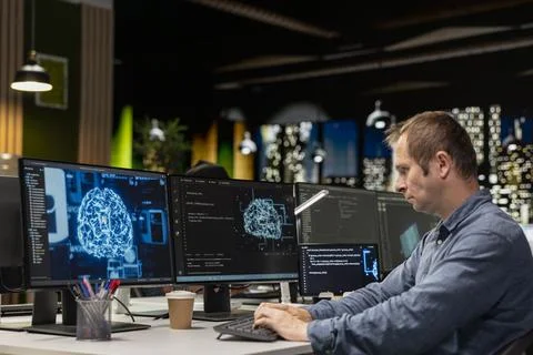 Software developer in office automating repetitive tasks using AI scripts Foto stock