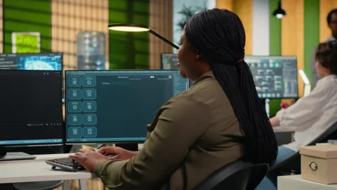 Software developer in office solving tasks with AI LLM chatbot answering prompts Stock Footage 323034344