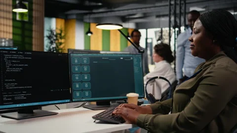 Software developer in office solving tasks with AI LLM chatbot answering prompts Stock Footage 323144984