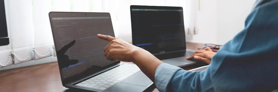 Software developer or programmer working data debugging improvement binary al Stock Photos