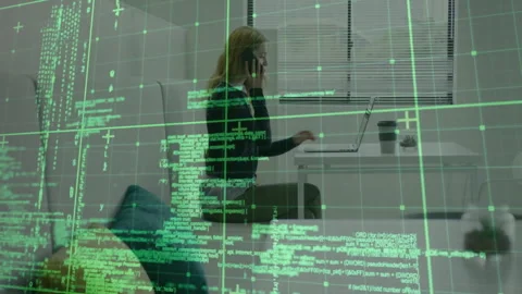 Software developer picking up smartphone and making phone call while coding with Stock Footage 312758299