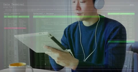 Software developer picking up tablet, activating data terminal overlay and Stock Footage 318544604