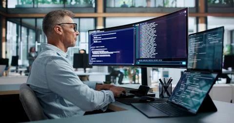 Software Developer Points At Code While Efficiently Working On Cloud-based Pr Stock-Fotos