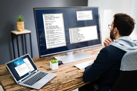 Software Developer Programmer Using Computer Stock Photos