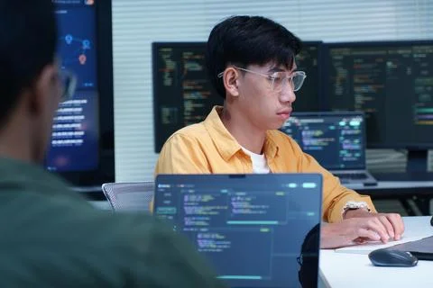 Software Developer Programming with Code in Technology Office Stock Photos