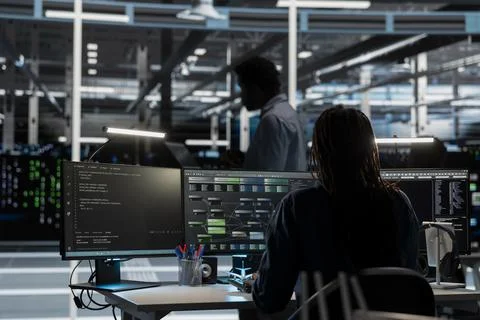 Software developer in server farm uses AI for machine learning workloads Stock Photos