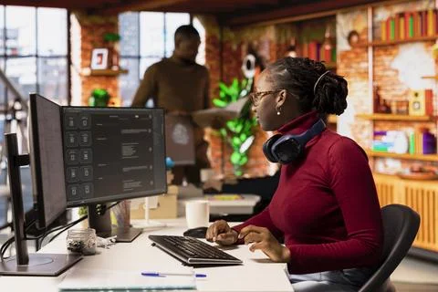 Software developer solving tasks with AI LLM chatbot answering prompts Stock Photos
