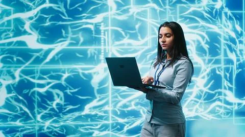 Software developer solving tasks on laptop, running artificial intelligence Stock Photos