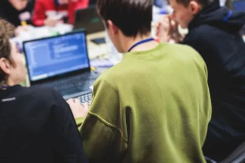 Software developer students in auditorium hall working on computer and lapt.. 스톡 사진