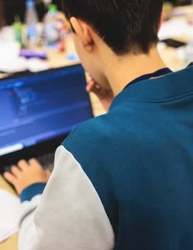 Software developer students in auditorium hall working on computer and lapt.. Stock Photos