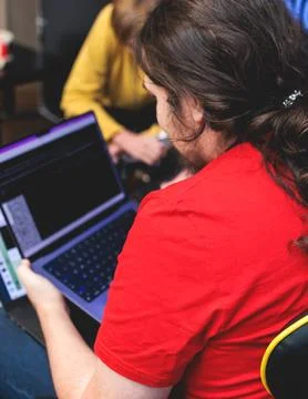 Software developer students in auditorium hall working on computer and lapt.. Stock Photos